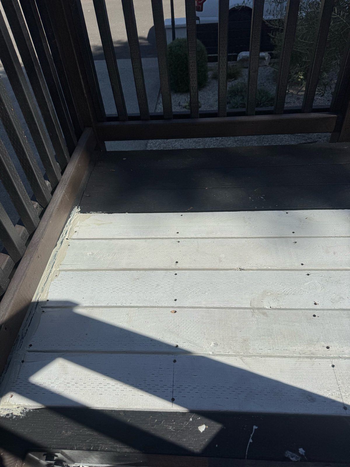 New replacement deck boards installed, fastened, and primed white before finish paint